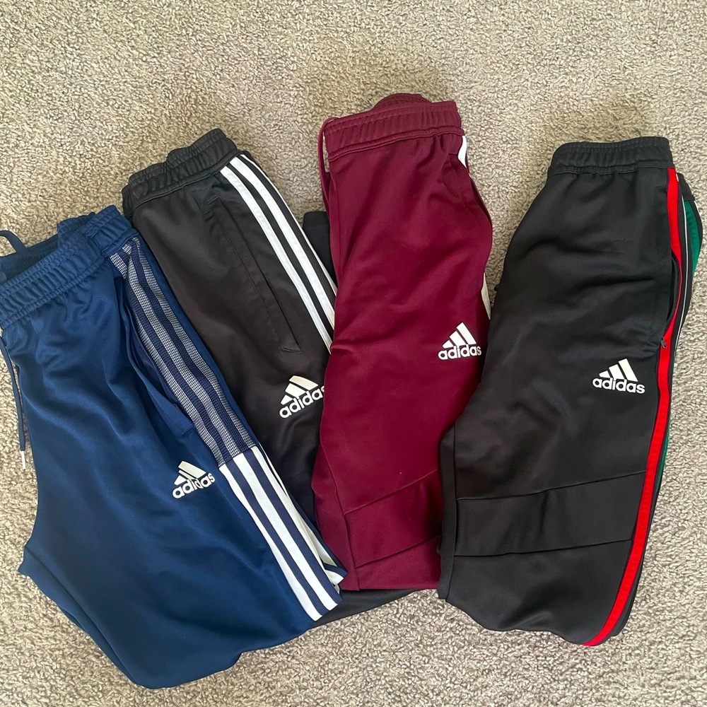 Bundle of Adidas stripe joggers.